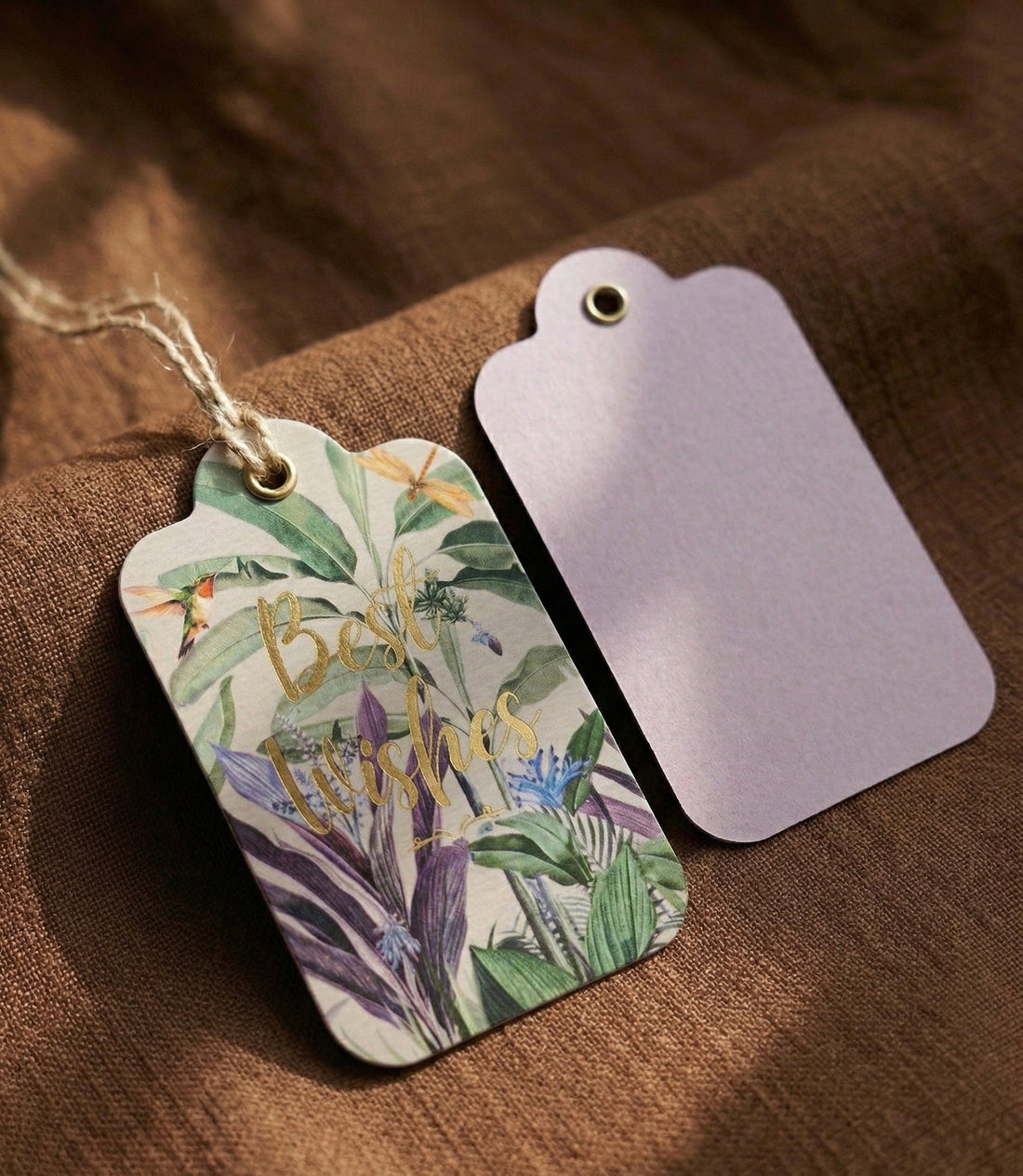 Wildforest gold-foiled gift tags styled on a gift box